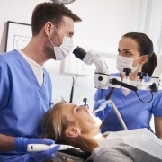 Conversation between two dentist in dentist's clinic